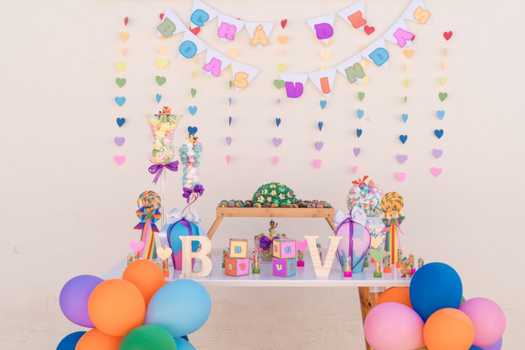 Vibrant and festive baby shower setup with balloons and decorations.